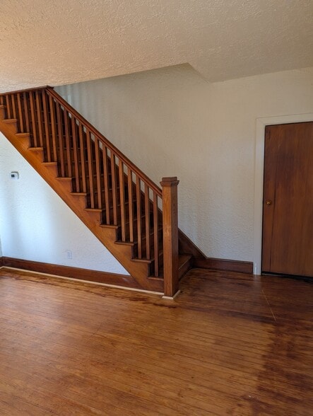 Living room stairs - 243 Walnut Street Rd