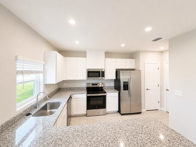 Building Photo - Available Now! Stunning 2025-Built 4BR/2BA South Lakeland Home with Office, Loft, and EV Charger!