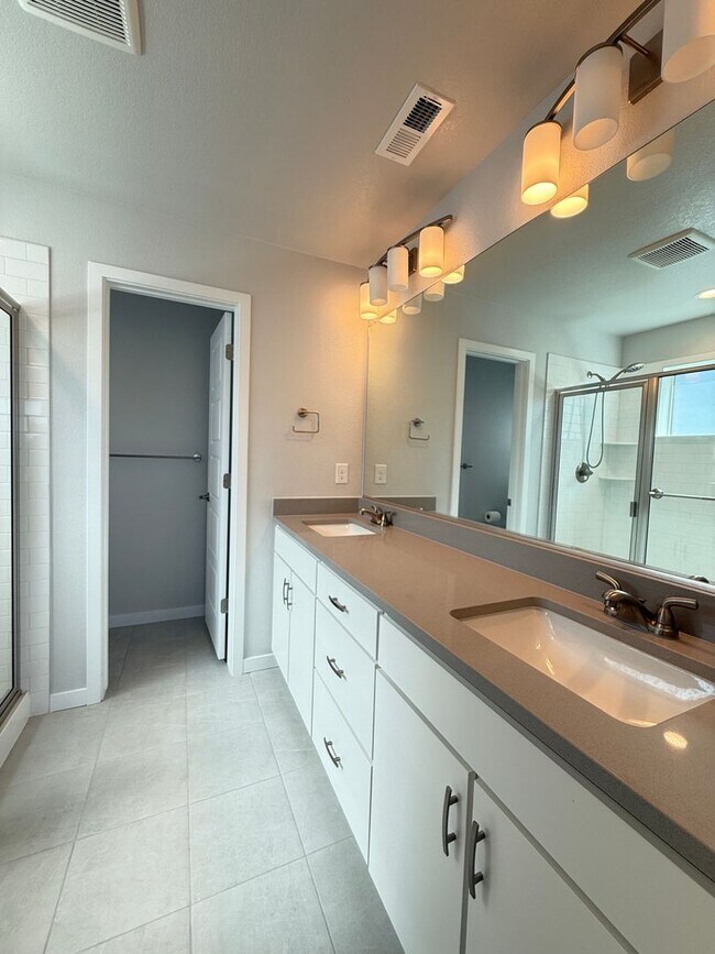 Building Photo - Stunning Luxury Living in Coal Creek with ...