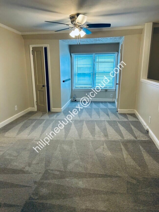 Living room with numerous closets - 629 Hillpine Dr NE