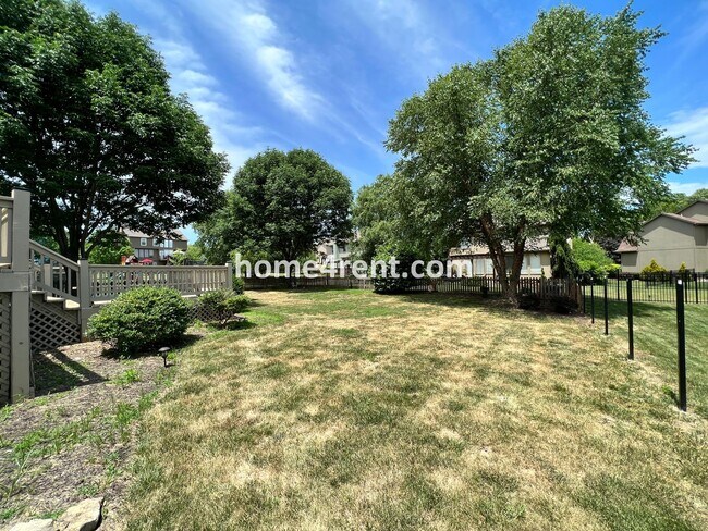 Building Photo - Updated Kitchen, Large Two Tiered Deck, Finished Basement in Blue Valley Schools!