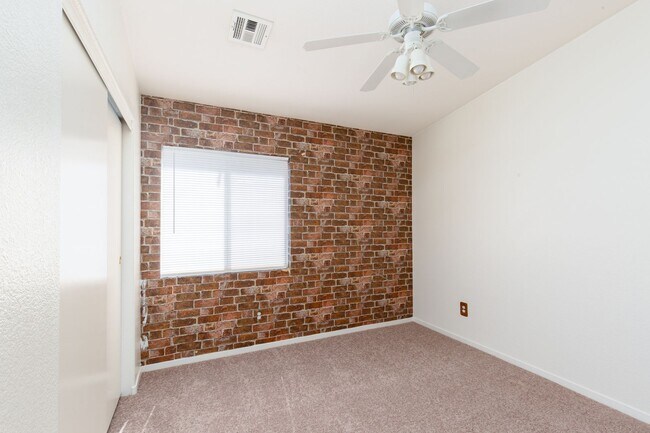Building Photo - Two bedroom townhome with garage in gated ...