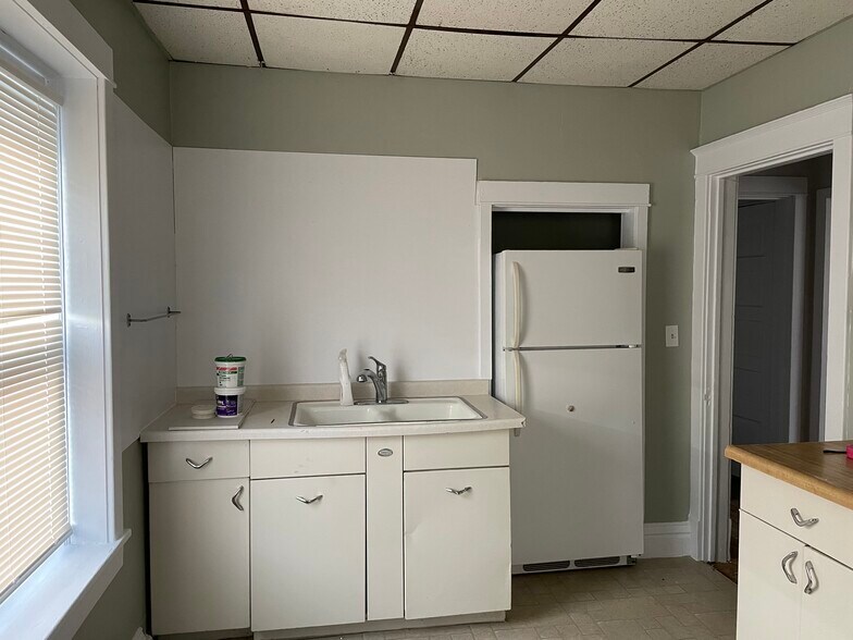 Kitchen with new shelving and upper cabinets coming soon - 432 E 7th St