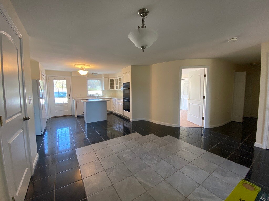Kitchen and Dining room showing Master Bed door - 3875 Union St