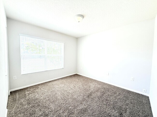 Building Photo - Spacious 4BR Home with Large Fenced Yard & Community Pool