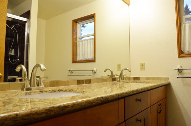 Building Photo - Private Summer Ridge Retreat with Vaulted Ceilings & Fenced Backyard
