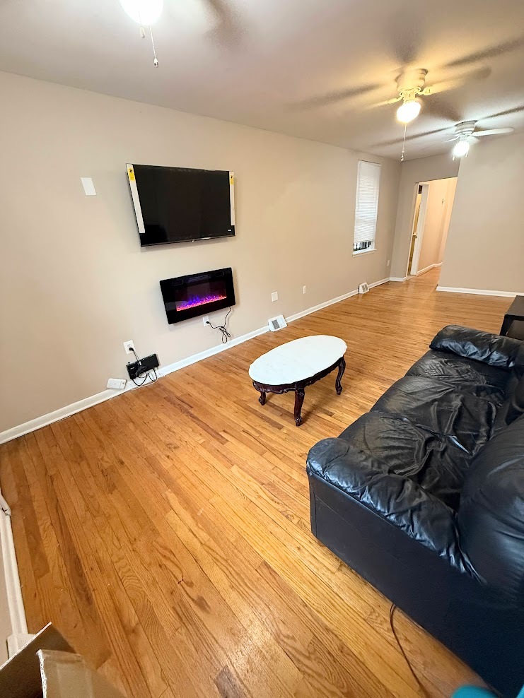 Huge Living Room With Mounted Electric Fireplace and TV - 2148 N Carlisle St