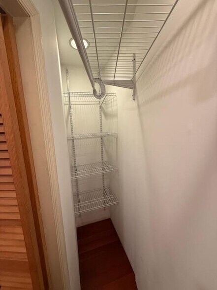 Kitchen Maid storage goes deep into closet for sheets, bedding and towel storage - 327 Hudson Ave