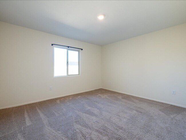 Building Photo - Spacious 4-Bedroom Home with Open Layout & Turf Backyard