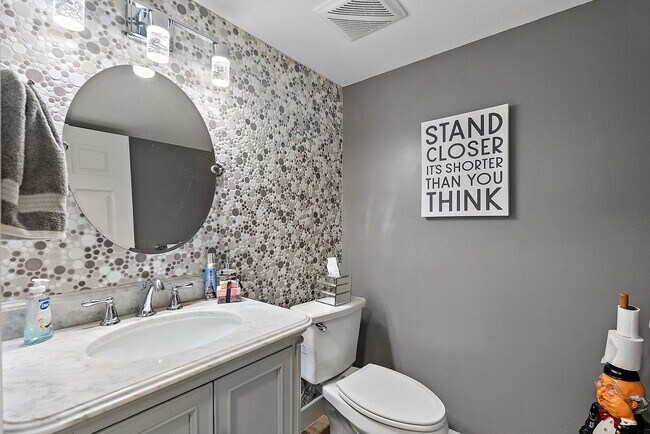 Building Photo - Two Bedroom/Two and a half bath gated townhome.