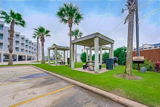 Multiple covered picnic tables/chairs w/ BBQ pits on site - 6102 Seawall Blvd