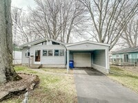 Building Photo - Amazing three bedroom 1 1/2 bathroom home, fenced in yard, extra storage, many updates!