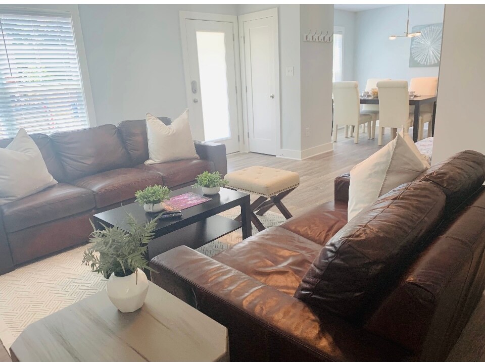 Spacious open concept living room with LVP flooring - 1017 Hightower St