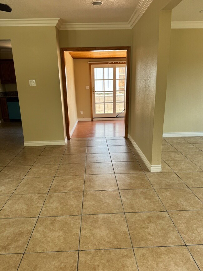 Building Photo - Large yard, spacious interior, extra parking and much more