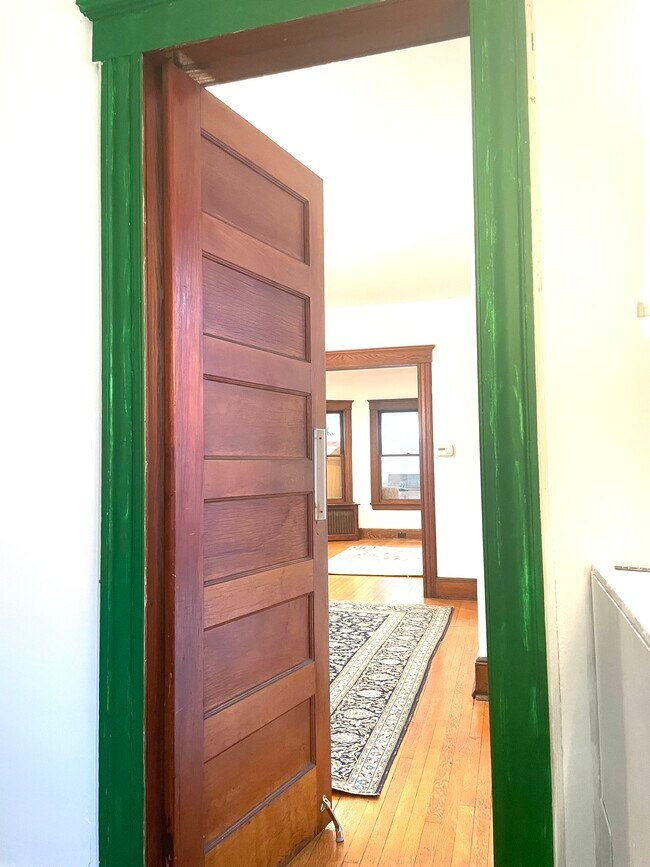 View of the living and dining room from the pantry - 499 Highland Ave