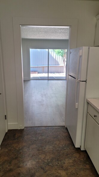 Kitchen facing back door - 110 SE Vista Ave