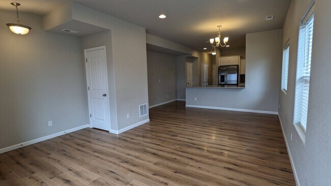 Building Photo - NEWER END UNIT TWO STORY TOWNHOME WITH A/C...