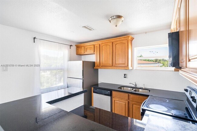 Building Photo - 6221 NW Miami Ct