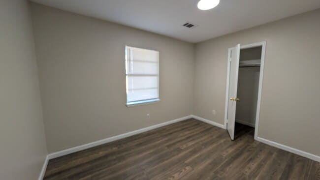 Building Photo - Fenced Yard, Lots of Light, Hard Floors Throughout