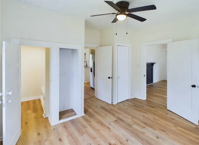 Flex room has a modern ceiling fan and wood-style flooring, adding both charm and functionality. - 1011 Elm St