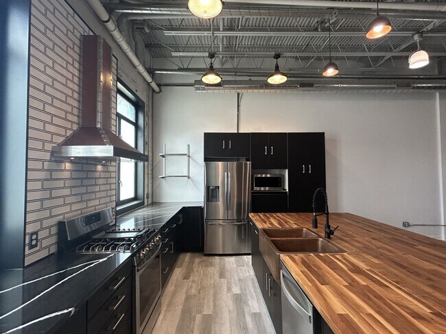 Building Photo - Industrial Style. Downtown Energy. Elevated Living.