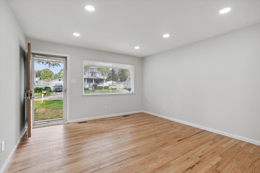 Living room with recessed lighting. - 9244 Northern Ave