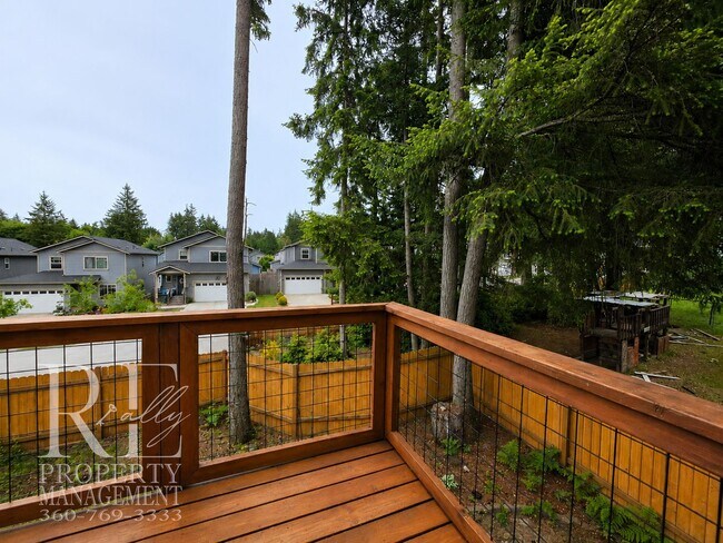 Building Photo - Spacious 3-Story Home with Flexible Living Space, Heat Pump & Private Deck Retreat