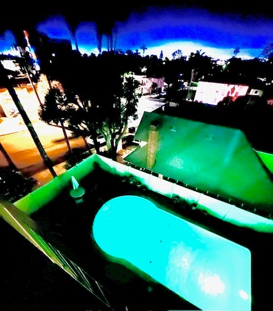 Pool View From Patio At Night - 3450 2nd Ave