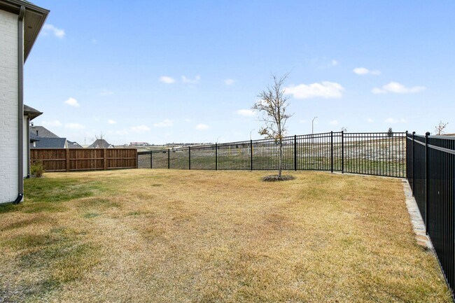 Building Photo - Stunning 4-Bedroom Luxury Residence with Bonus Office in the Prestigious Walsh Community LIKE NEW!