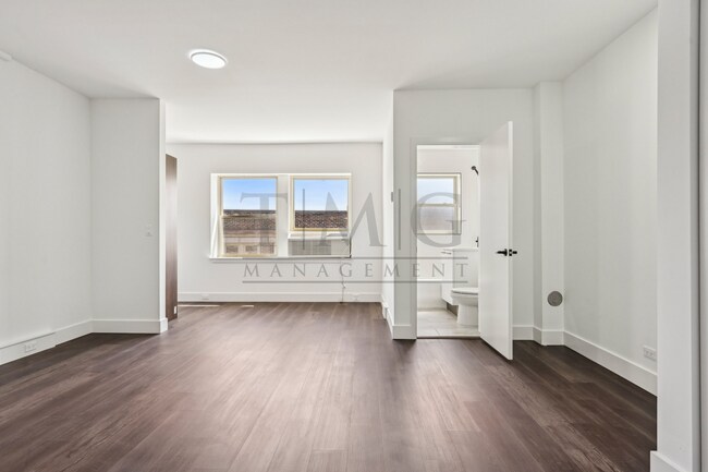Building Photo - Sleek, Bright & Brand New — Stylish Studio...