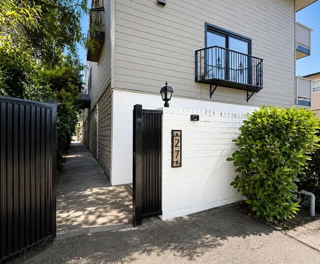 Building Photo - Spacious 2BR Condo with Central A/C, Bonus Room & Huge Storage – Walk to Burlingame Avenue