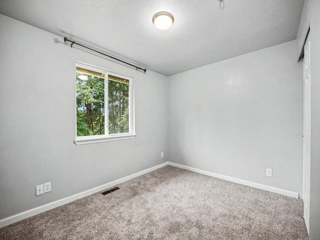 Building Photo - Spacious 4-Bedroom Lacey Home with A/C, Basement Bonus Space & Wetlands Privacy
