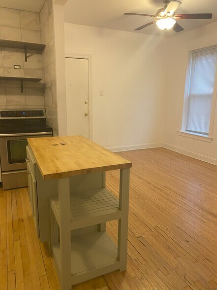 Open kitchen to dining-living room - 2900 N Richmond St
