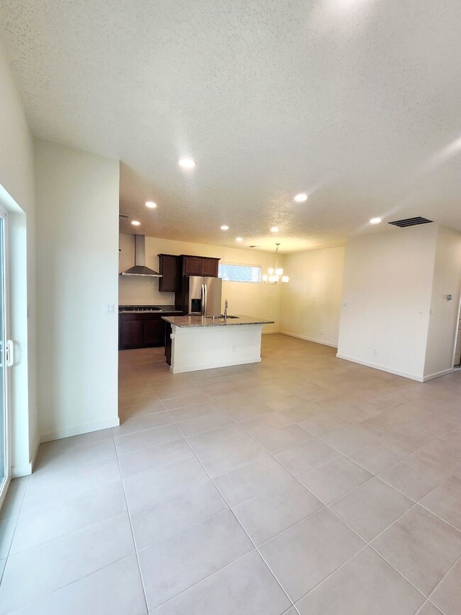 Building Photo - Brand-New Construction Townhome – Never Li...