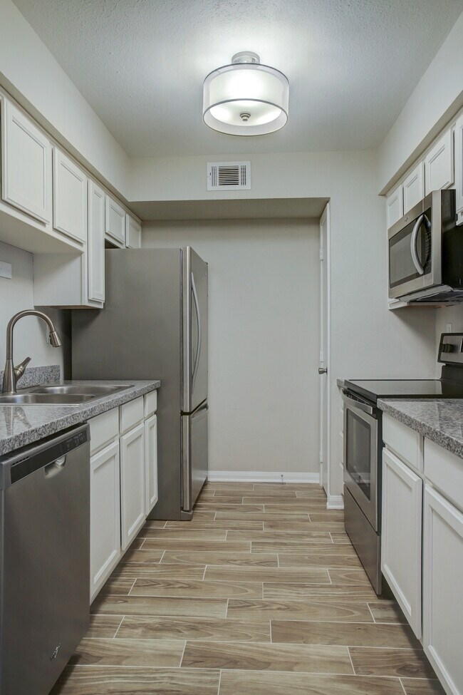 Kitchen w/all stainless steel appliances. - 1880 White Oak Dr. Apt 119