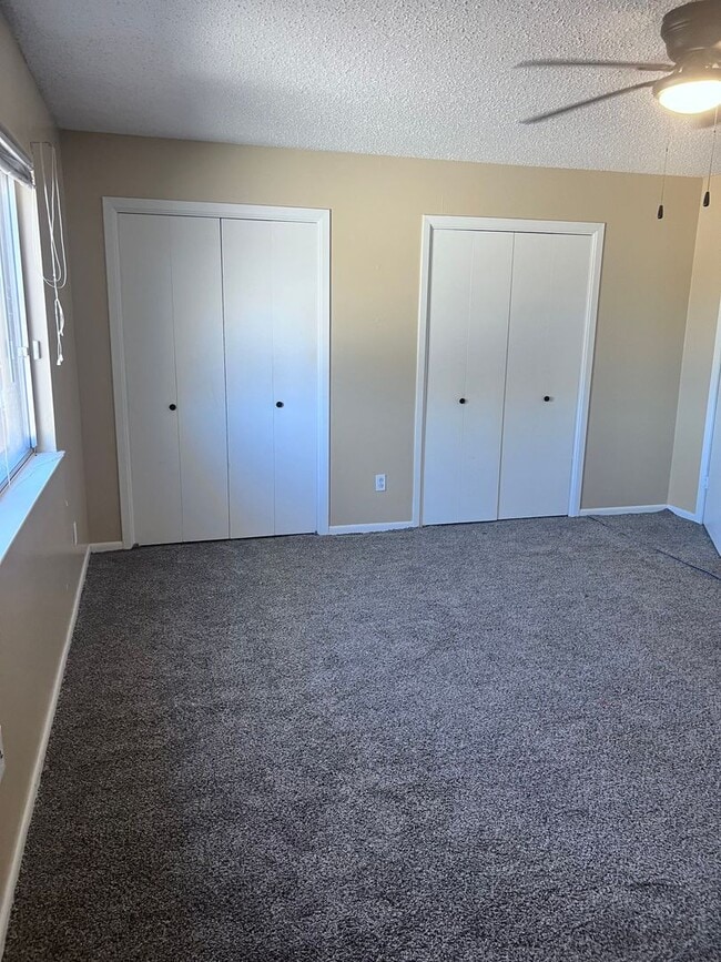 Building Photo - Introducing a 2-bedroom, 1.5-bathroom condo that offers the perfect blend of comfort and convenie...