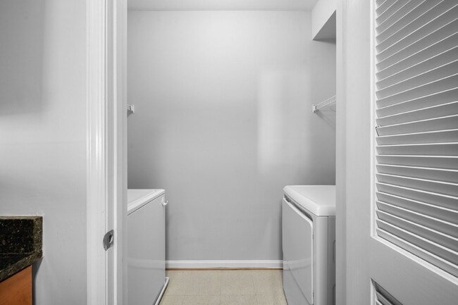 Building Photo - Two-bedroom, two-bathroom model with a den, located on the third floor.