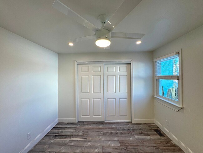 Building Photo - RENOVATED 3 bedroom end unit across the street from the Beach!