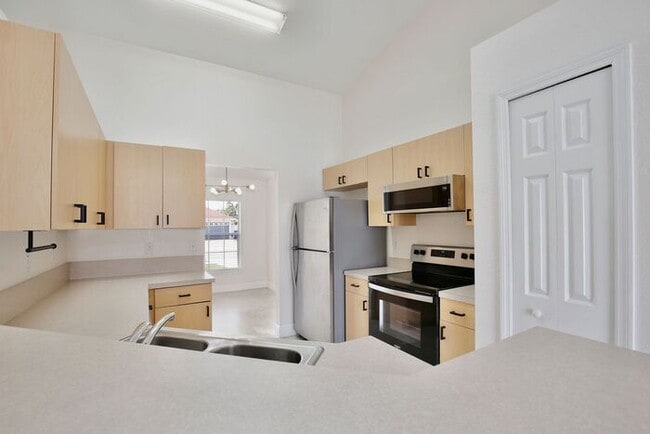 Building Photo - Beautiful 3/2 Spacious Home with a covered patio and a 2 Car Garage in Villa Homes Village - St C...