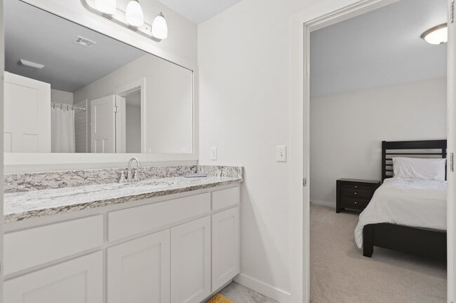 Building Photo - Stunner! This beautiful home features a spacious open floor plan with primary suite and private o...