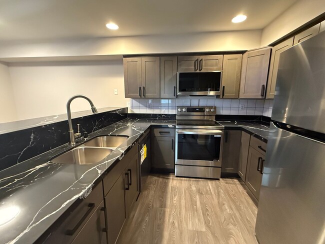 Building Photo - Move-In Ready! Renovated Modern 2BD/1BTH E...