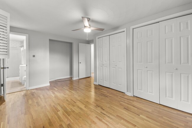 Primary bedroom with attached bathroom. - 1618 Oak Hills St