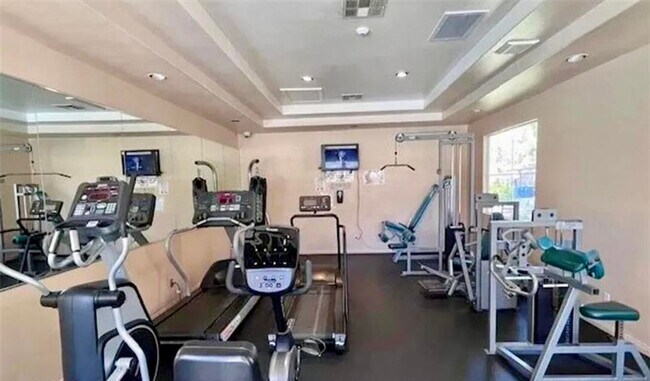 Building Photo - 2 bed, 2 bath condo located in gated community w/lush landscaping, 2 pools, spas, BBQ areas & clu...