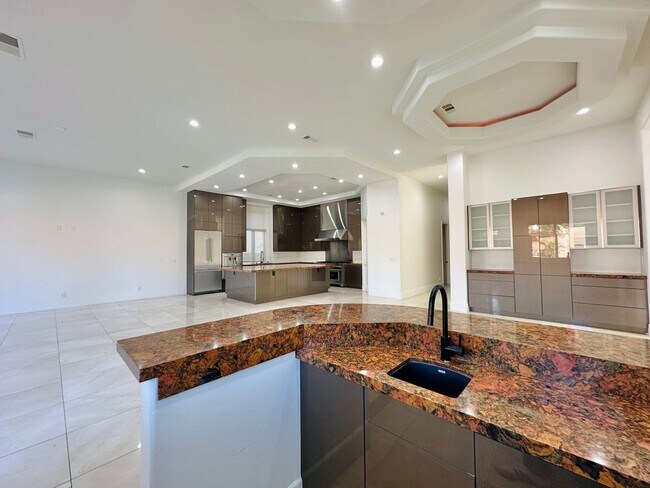 Building Photo - Stunning home with pool in prestigious Eagle Hills!