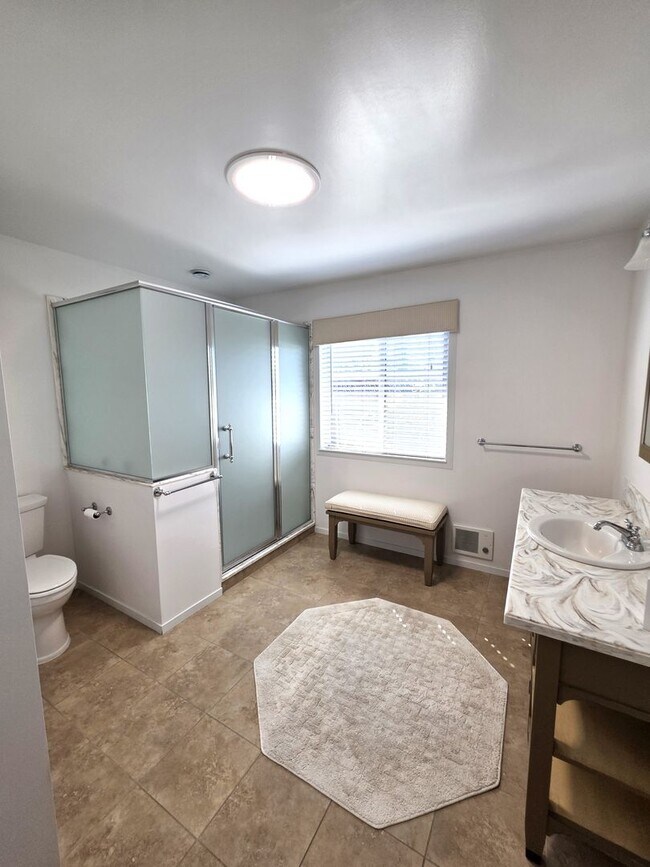 Building Photo - Delightful Single Story 2/2 with Expanded Bath and Beautiful Gardens