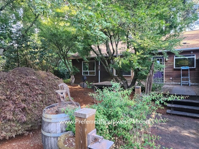 Primary Photo - Beautiful home on 2 organically-landscape ...
