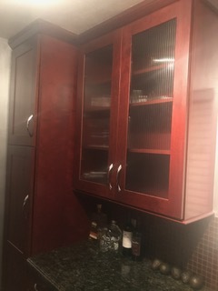 Cherry wood cabinet with glass doors. - 1857 Pandora Ave