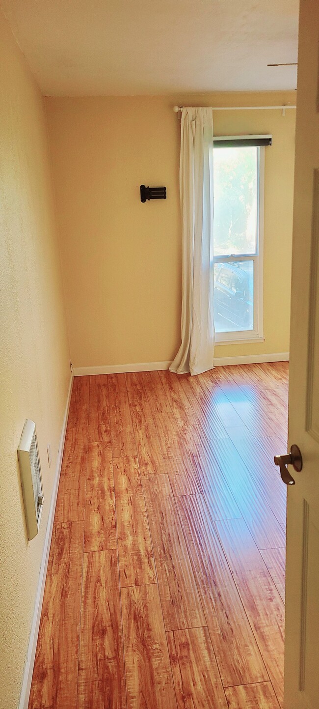 Primary bedroom. Note: there is a sneaky shoe closet behind the entry door :) - 466 Crescent St