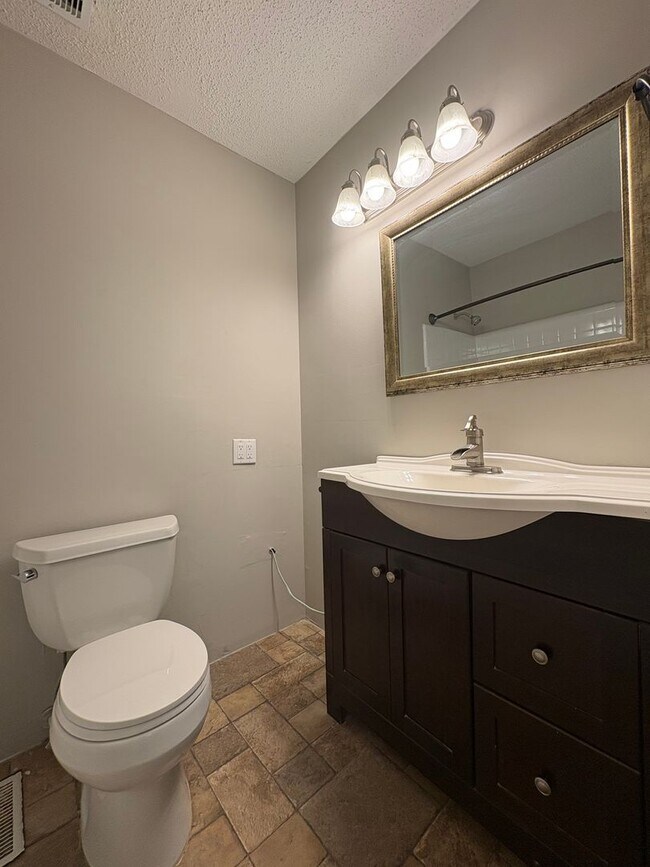 Building Photo - Four Bedroom Townhome Available Now