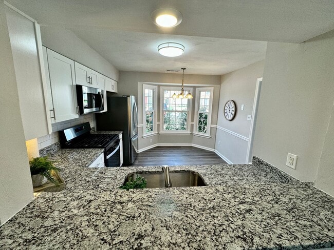 Building Photo - COMPLETELY Updated & Ready 08-21-26!! Sparkling Community Pool - Pet Friendly - Fenced Backyard!